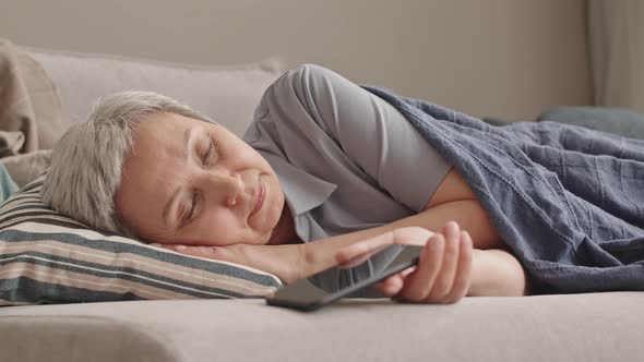 Woman Sleeping with Smartphone alt
