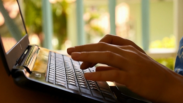Female Hands Using Laptop Outdoors alt