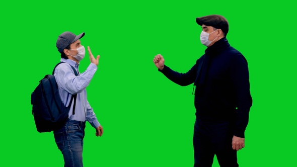 Two Men in Protective Mask Refuse to Shake Hands During COVID-19 Pandemic