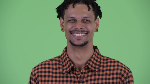 Face of Happy Young Handsome African Man Smiling alt