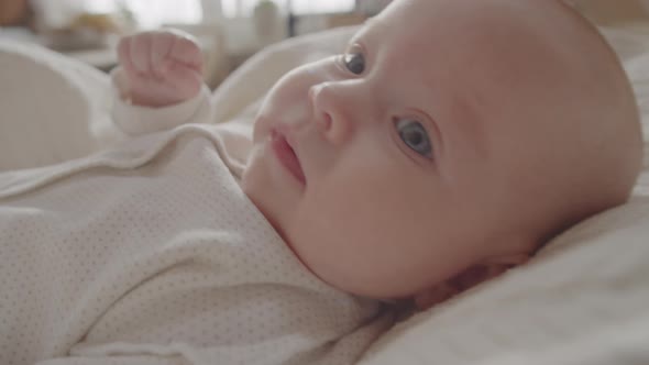 Lovely Newborn Baby Lying on Bed alt