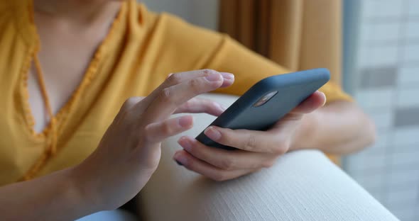 Woman use of smart phone at home alt