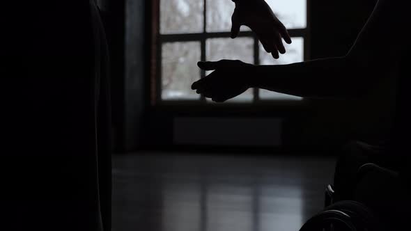 Silhouette of Dancers Holding Hands in Ballroom alt