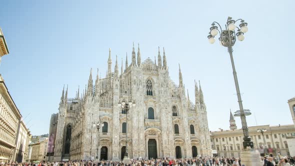 Milan Cathedral in Gothic Style and Tourists on Square alt