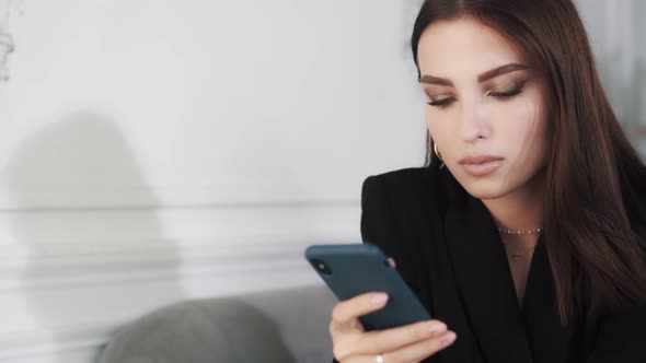 Young Woman Model with Bright Makeup Chatting in Social Networks alt