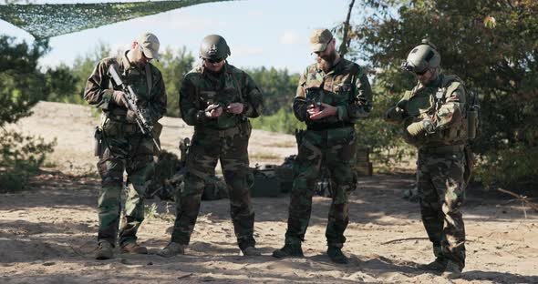 Four Men Stand Guard Soldiers Dressed in Moro Uniforms Army in Readiness to Defend the Territory alt