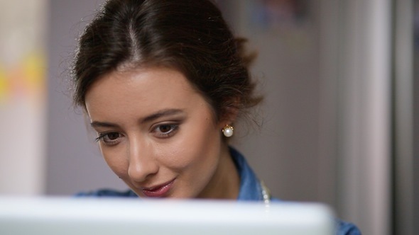 Young Woman Working On Her Laptop