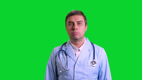 Young Doctor Stand and Smile on Green Chroma Key Background alt