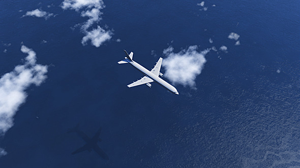 Airplane Flying Above The Ocean