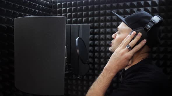 Rap Singer Sings Hiphop at Recording Room with Studio Microphone
