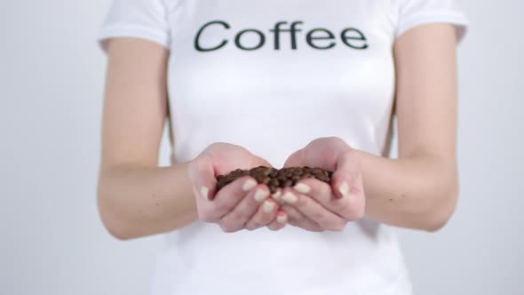 Unrecognizable Woman Holding Coffee Beans alt