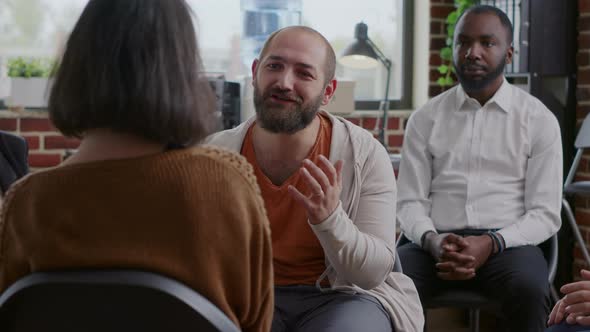 Man Doing Handshake with People After Sharing Progress and Success at Aa Group Meeting alt