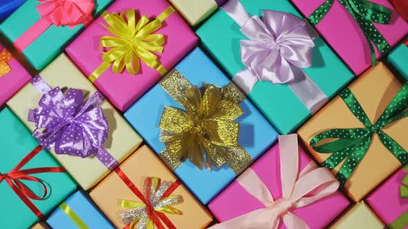 Beautiful Gift Boxes Wrapped In Colored Wrapping Paper With Ribbon Bows