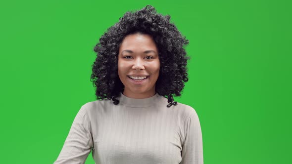 Green Screen Young African Female Shows Sign Digital Currency
