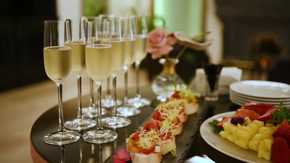 Glasses with Champagne and Fruits on Buffet Table at a Restaurant or in the Hotel Lobby