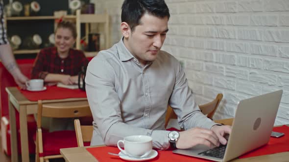 Businessman at Break in Cafe alt
