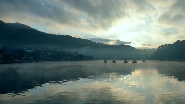 Beautiful Moving Fog In Mountain Lake With Boats Sailing Peacful Morning Scenery Slow Motion