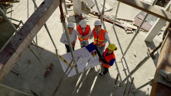 Top view corner, civil engineering team Along with the architect and foreman watching the Blue Print