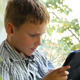 Boy Sitting By A Window Using His Tablet 3 - VideoHive Item for Sale