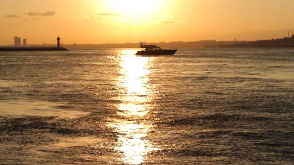 Sunset And The Boat Over The Sea