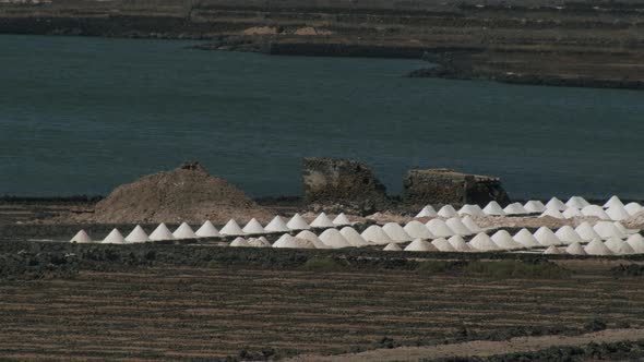 Scenery of Salinas de Janubio with piles of extracted salt, Lanzarote alt