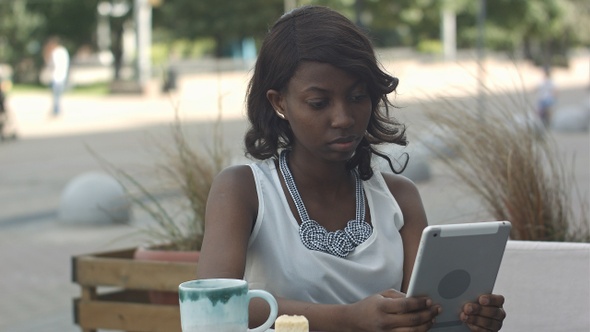 African Young Business Woman Working and Using Tablet In