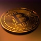 Golden bitcoin slowly rotating on goldish floor - VideoHive Item for Sale