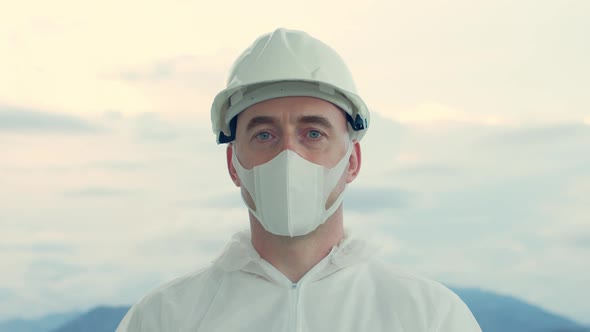 Portrait of a Professional Engineer of a Construction Industrial Company Wearing a Protective Mask alt