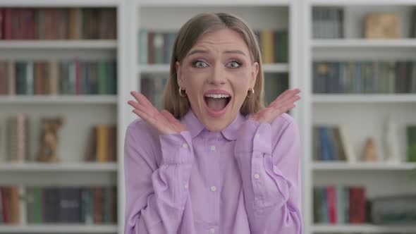 Portrait of Excited Woman Surprised By Results Wondering alt