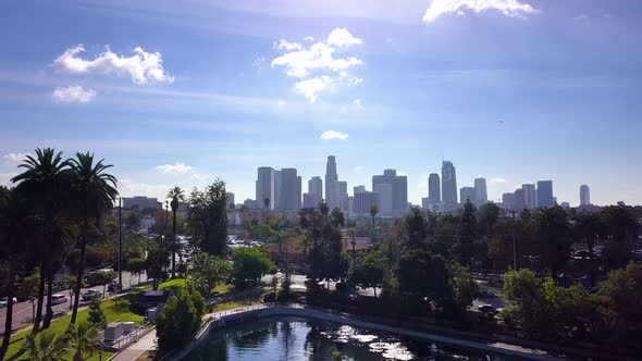 American City Of Los Angeles Skyline With Clouds Over Green Park Aerial 