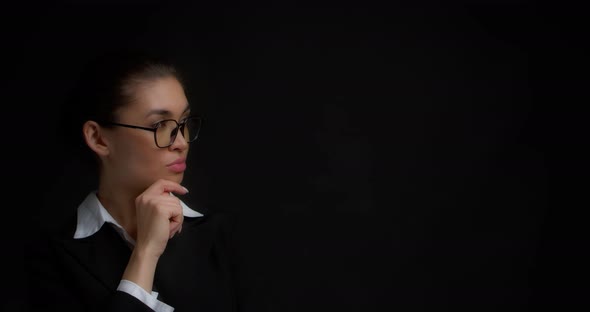 Woman with Glasses is Thinking About Something She Came Up with an Idea alt