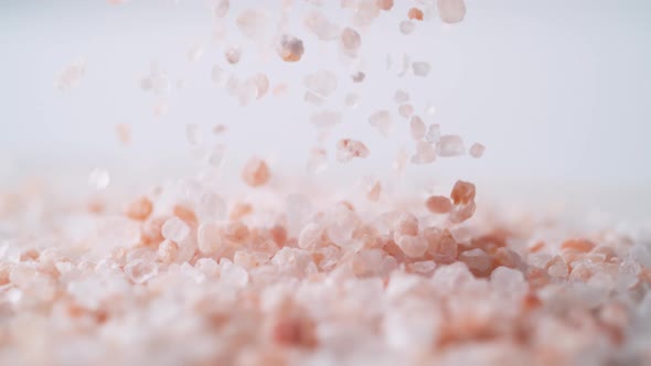 Himalayan rock salt falling. Slow Motion. alt