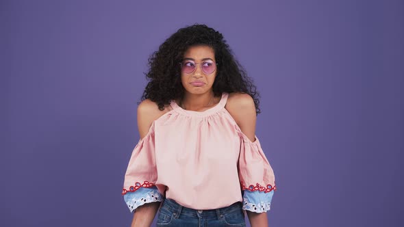Ethnic Black Girl in Sunglasses Colorful Blouse and Jeans alt