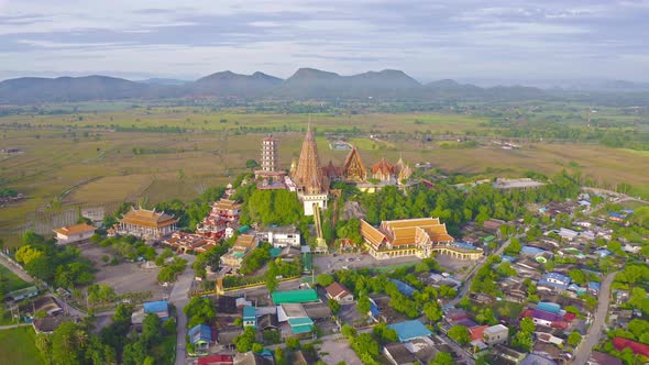 Aerial view of Big Golden Buddha Statue and pagoda in Tiger Cave Temple or Wat Tham Suea alt