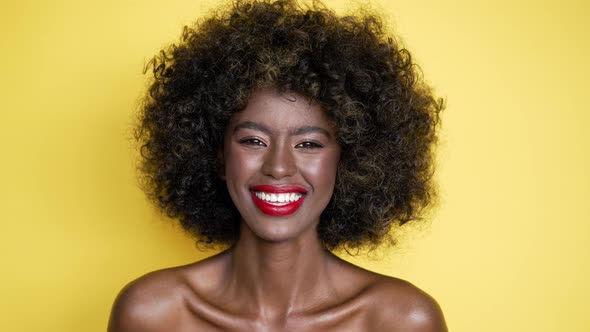 Cheerful Black Woman with Curly Hair