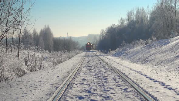Train Rides in Beautiful Winter Landscape. Professional Video with Slider.