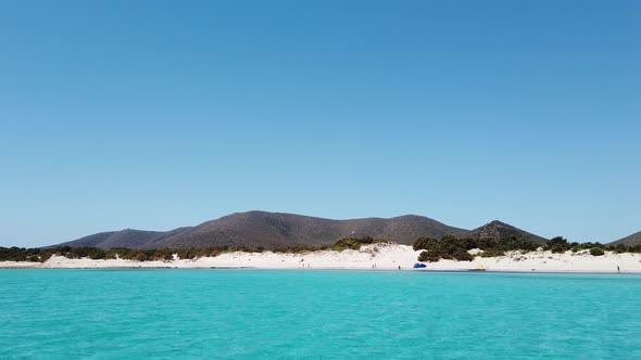 The incredible colors of the water of Cala Zafferano, Sardinia, Italy. alt