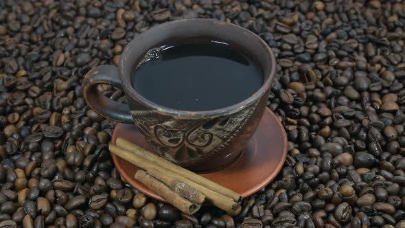 Cup Of Cinnamon And Coffee Beans