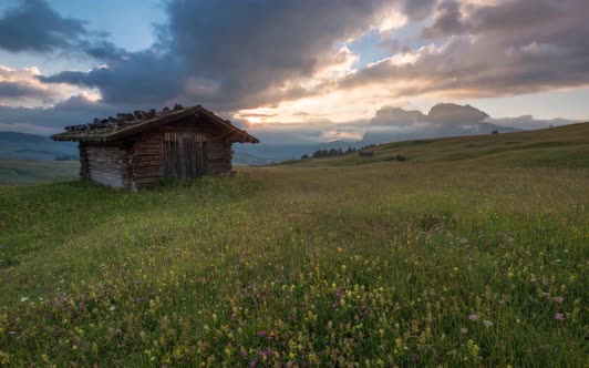Clouds Dancing Over the Dolomites Mountains at Sunrise  alt