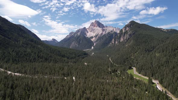 Aerial view of the green mountains forest in Dolomites, Italy alt