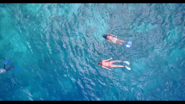 Aerial drone abstract of idyllic shore beach adventure by blue sea with clean sandy background of a  alt