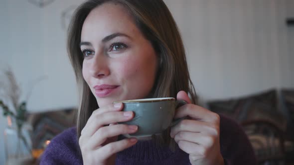 Beautiful Woman Drinking Coffee In Cafe