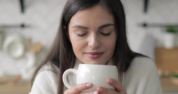 Young Girl Enjoying Her Coffee alt