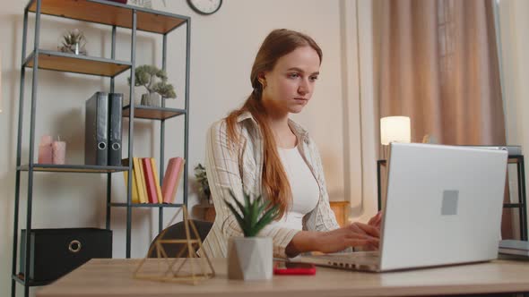 Young Woman Girl Using Laptop Computer Sitting at Table Working Online Shopping From Home Office alt