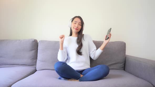 Woman use smart phone for listen music