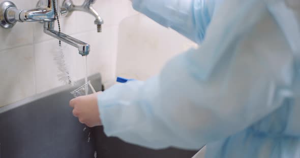 Scientist Washing Beaker At Laboratory, Stock Footage | VideoHive