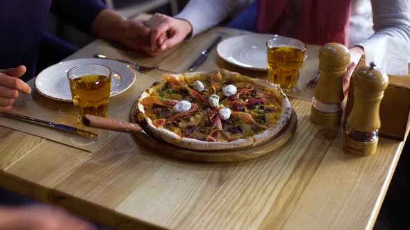 Romantic Couple Gets Ordered Italian Pizza from Waiter in Restaurant alt