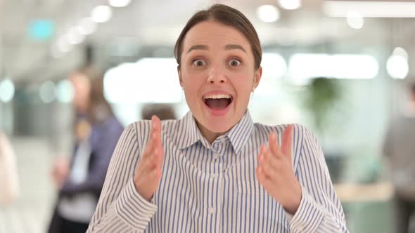 Portrait of Excited Young Woman Celebrating Success alt
