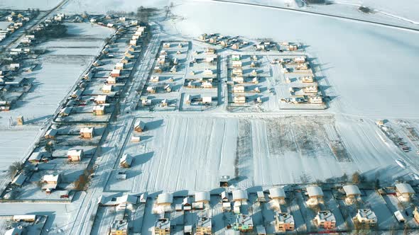 Countryside Road And Village Snowcovered Gardens And Field In Winter Day alt