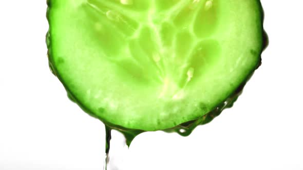 Super Slow Motion with a Piece of Cucumber Drains Water alt